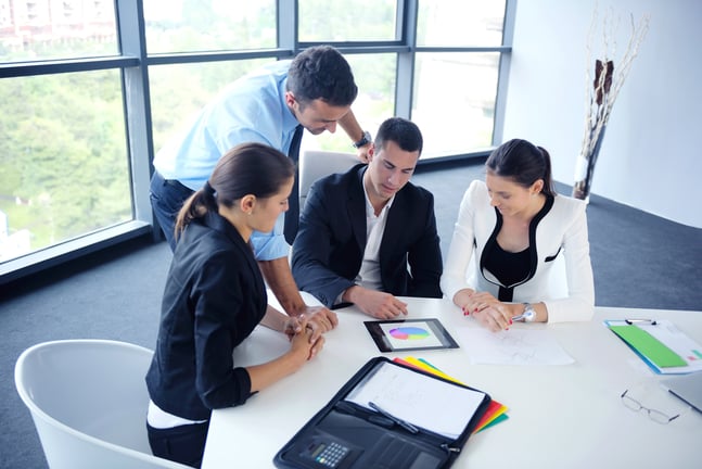 Group of happy young  business people in a meeting at office