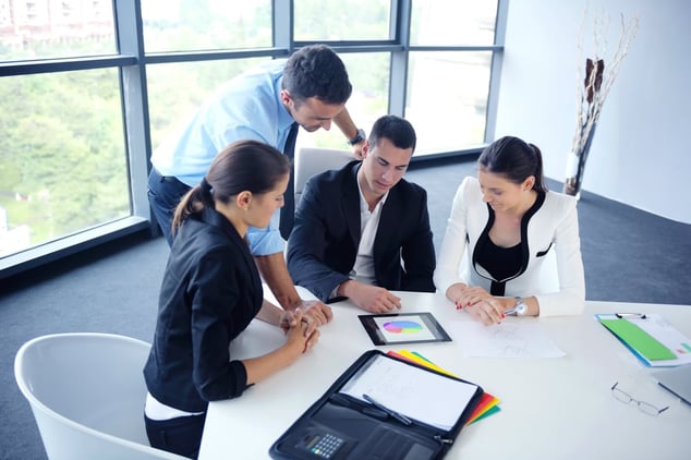 Group of happy young  business people in a meeting at office
